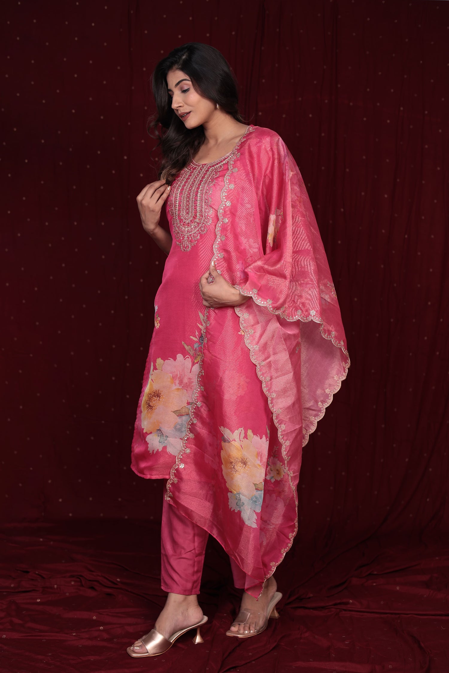 Back view of the deluxe shimmer organza pink suit, showing the elegant drape and the soft muslin pant.