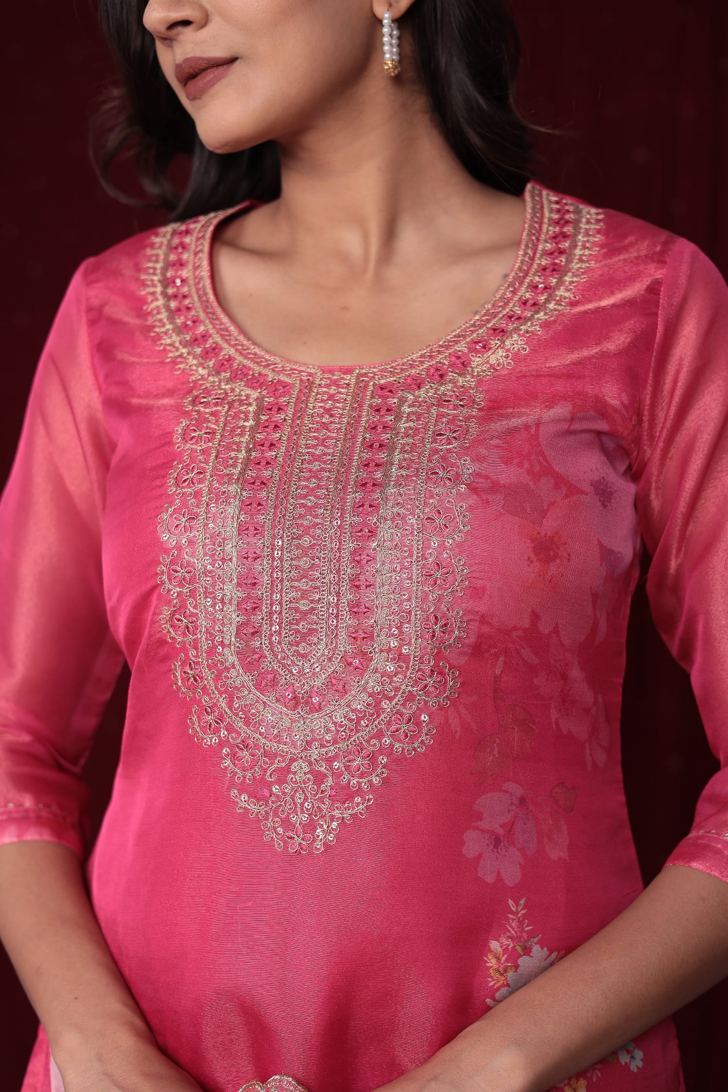 Detailed view of the soft organza dupatta with vibrant floral embroidery and print, paired with the pink ethnic suit.