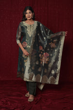 Close-up of the rich texture of the jacquard fabric on the kurti and dupatta, alongside the smooth feel of the soft silk pant, highlighting material quality.