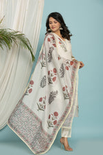 Side profile of model showcasing the light and airy feel of the white Kota Doria suit and dupatta.