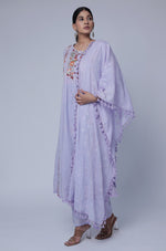 Side profile of model showcasing the voluminous flare and elegant drape of the lavender embroidered Anarkali kurta set with dupatta.