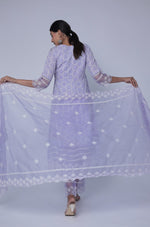 Close-up of the delicate white Chikankari embroidery on the V-neckline of the lavender Anarkali kurta, highlighting intricate details.