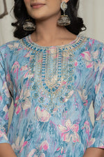 Close-up of the delicate embroidery detailing on the round neckline of the light blue cotton kurti, with visible multicolor mill print.