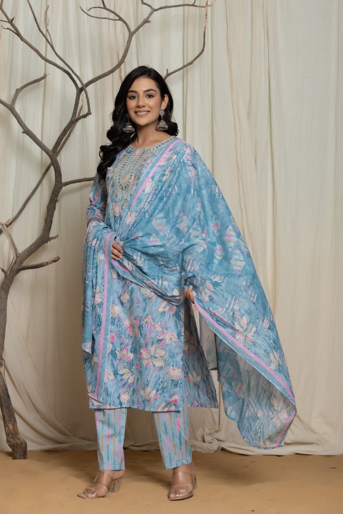 Side profile of model showcasing the comfortable fit and elegant drape of the light blue cotton premium mill print dupatta set with embroidery.