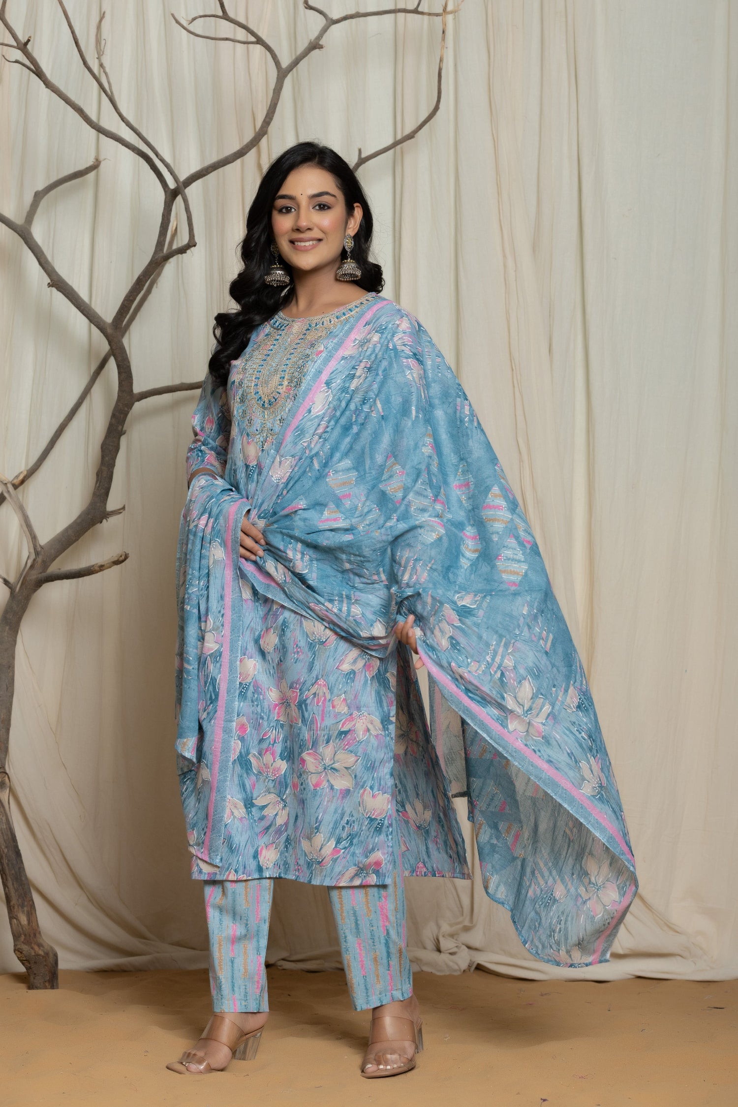 Side profile of model showcasing the comfortable fit and elegant drape of the light blue cotton premium mill print dupatta set with embroidery.