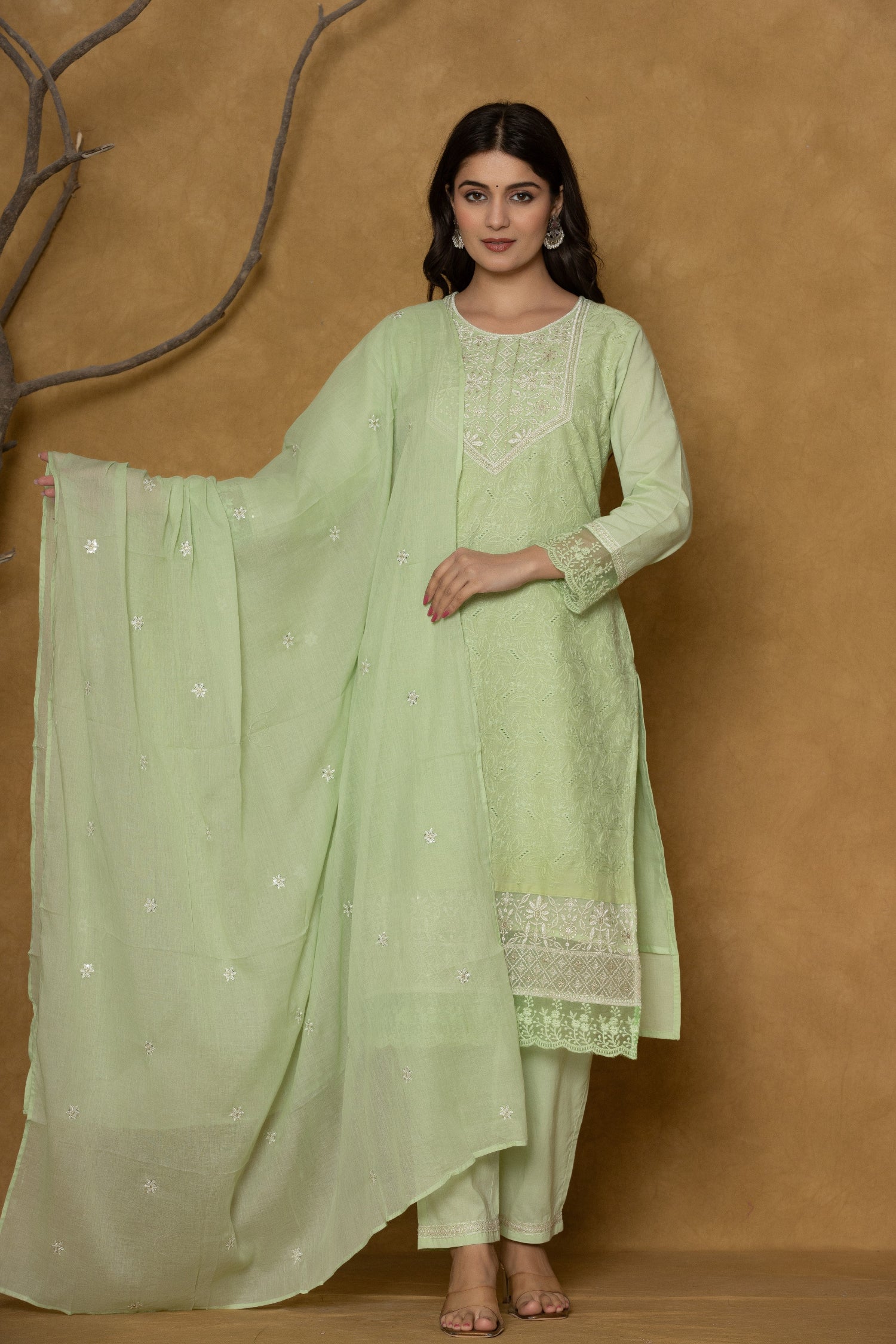 Side profile of model showcasing the comfortable fit and elegant drape of the light green premium cotton Chifley dupatta set.