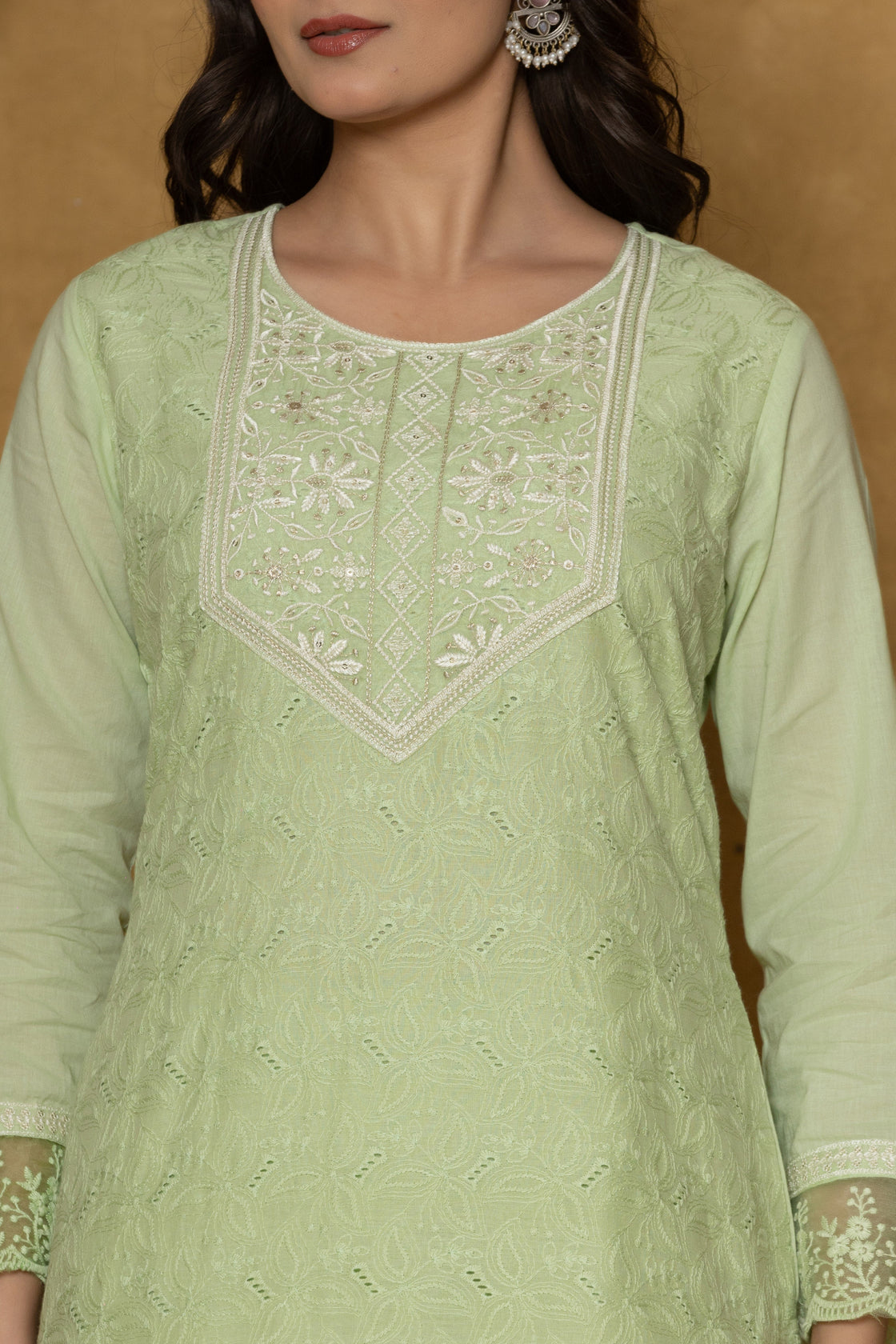 Close-up of the delicate white embroidery on the V-neckline and front of the light green cotton kurti, from the Chifley dupatta set.