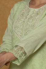 Detailed view of the embroidered cuff and sleeve of the light green cotton kurti, showcasing the delicate Chifley fabric texture.