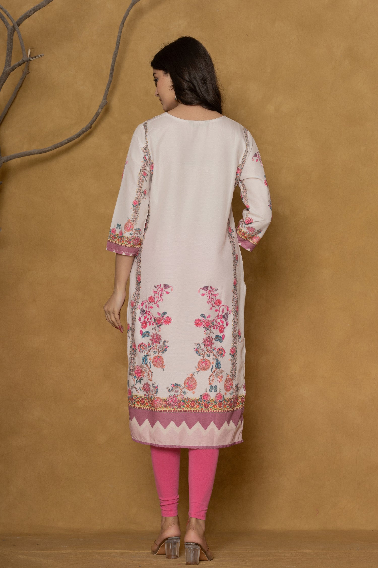 Back view of the light pink kurta, showing the consistent floral-geometric print and comfortable silhouette.