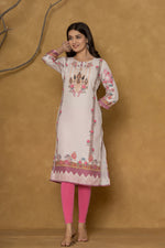 Model in a confident stance, highlighting the full length and overall detailed patterned design of the light pink kurta with handwork.