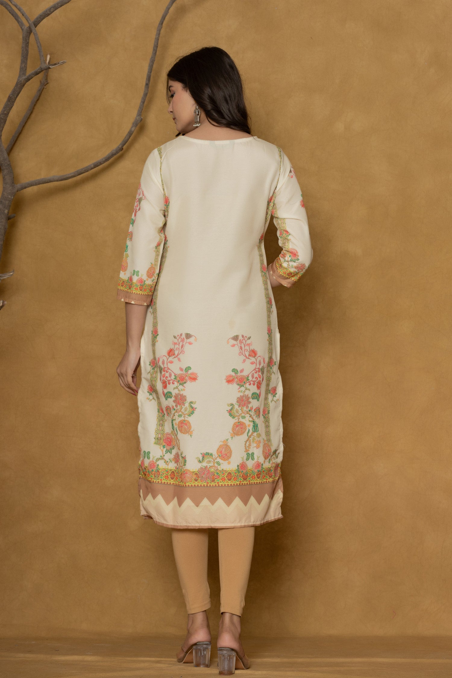 Back view of the light yellow kurta, showing the consistent floral print on the hem and comfortable silhouette.