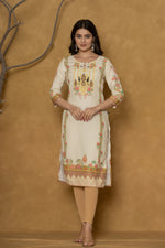 Model in a confident stance, highlighting the full length and overall detailed floral print design of the light yellow kurta with handwork.