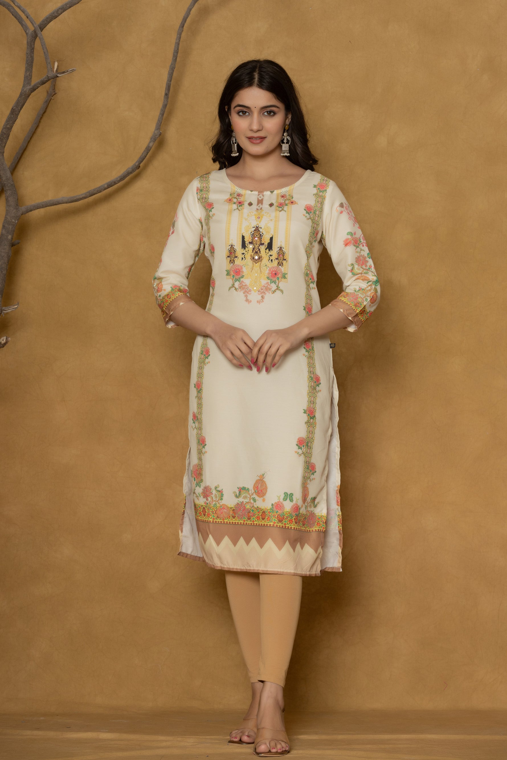 Model in a confident stance, highlighting the full length and overall detailed floral print design of the light yellow kurta with handwork.
