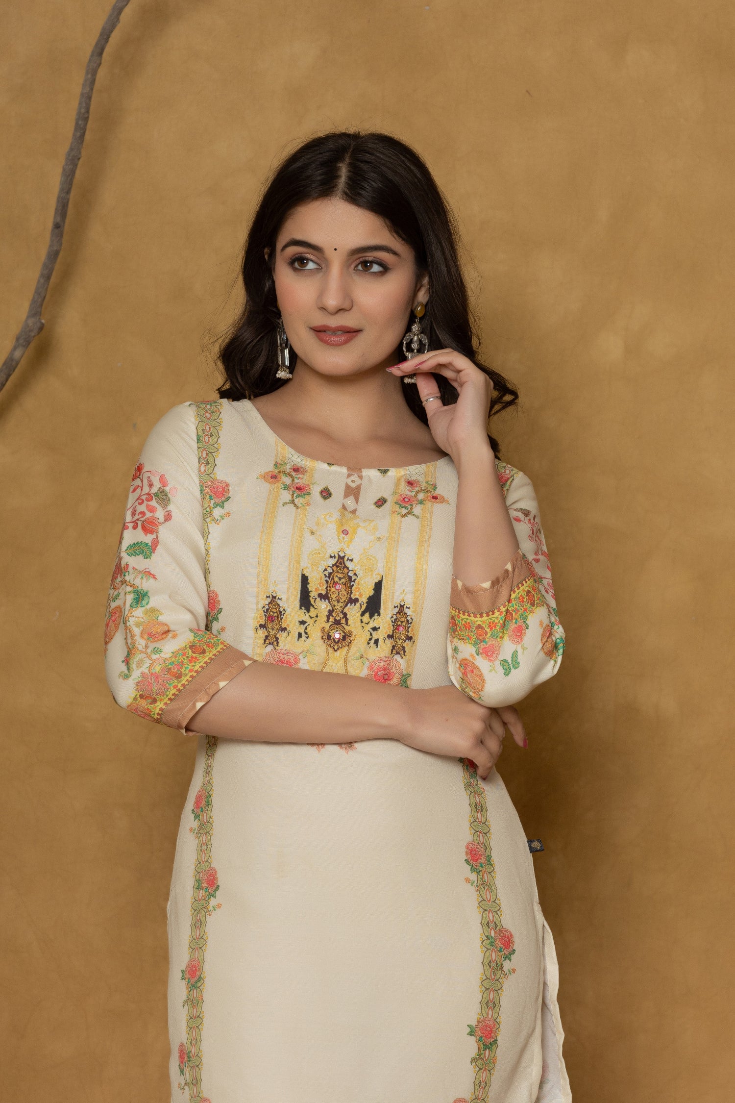 Side profile of model showcasing the comfortable fit and elegant floral design of the light yellow kurta with handwork detailing.