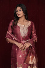 Side profile of model showcasing the elegant drape and luxurious feel of the deluxe jacquard organza maroon suit.