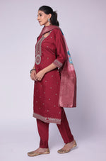 Model gracefully posing in the maroon soft silk suit set, highlighting the beautiful flow and movement of the printed jacquard dupatta.