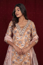 Side profile of model showcasing the flow of the pure cotton mustard brown dupatta set with its manual embroidery and comfortable fit.