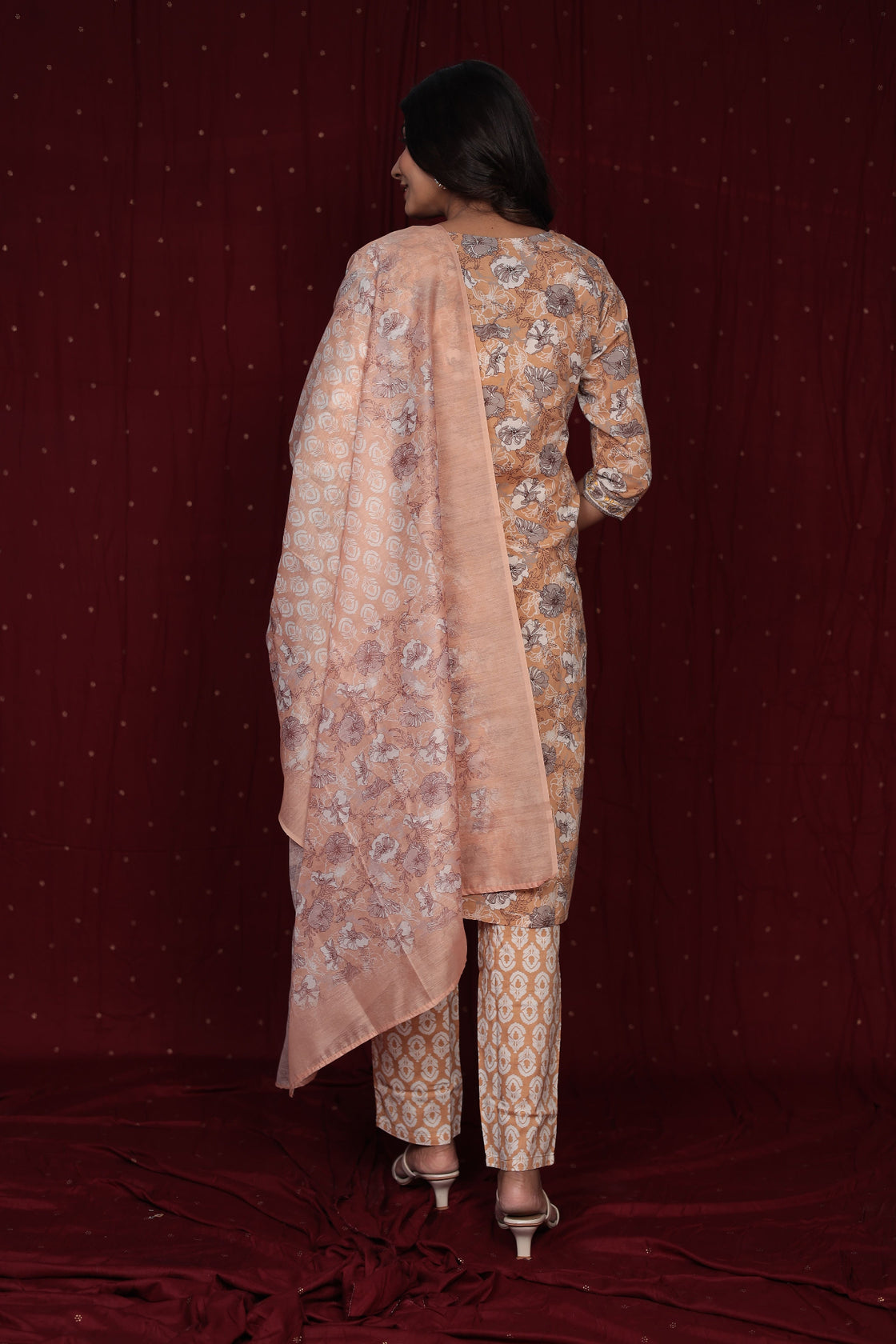 Back view of the pure cotton mustard brown dupatta set, showing the consistent print and comfortable silhouette of the kurta and pants.