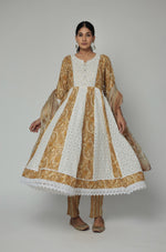 Model twirling in the mustard yellow Schiffli Anarkali kurta set, showcasing the voluminous flare and comfortable movement of the outfit.