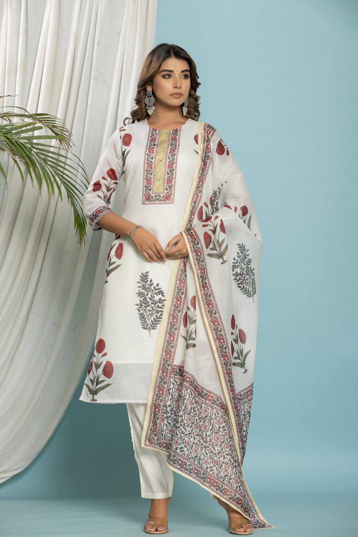 Side profile of model showcasing the light and comfortable fit of the off-white Kota Doria suit and dupatta.