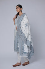 Model in a confident stance, highlighting the full length and overall elegant design of the off-white cotton jacquard dupatta set with blue detailing.