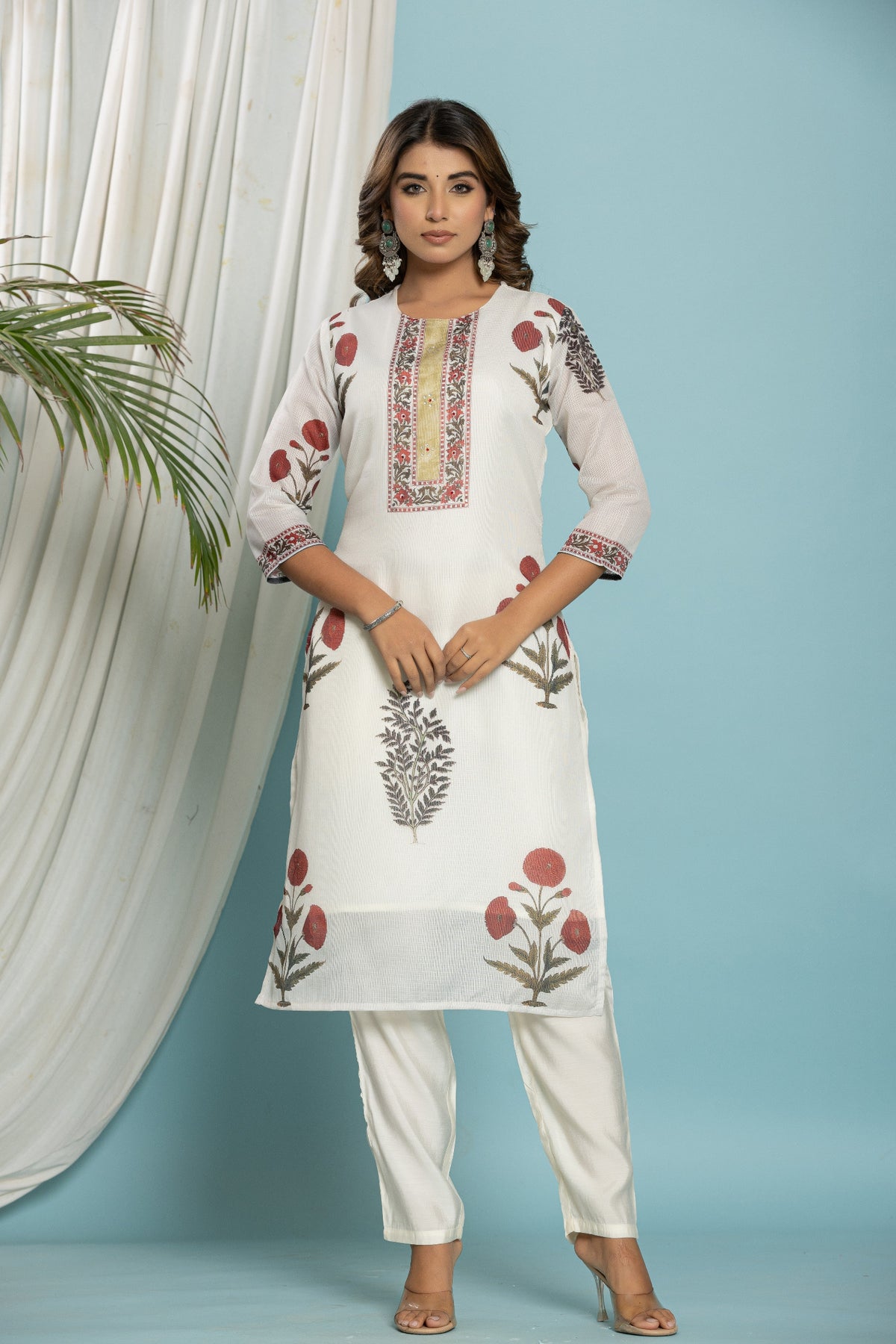 Model gracefully wearing the off-white floral printed Kota Doria dupatta set in a bright, natural setting, perfect for comfortable daily or casual wear.