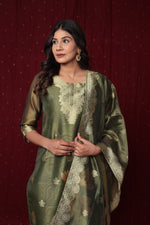 Close-up of the elegant gold embroidery on the neckline and the subtle woven jacquard patterns on the olive green organza kurti.