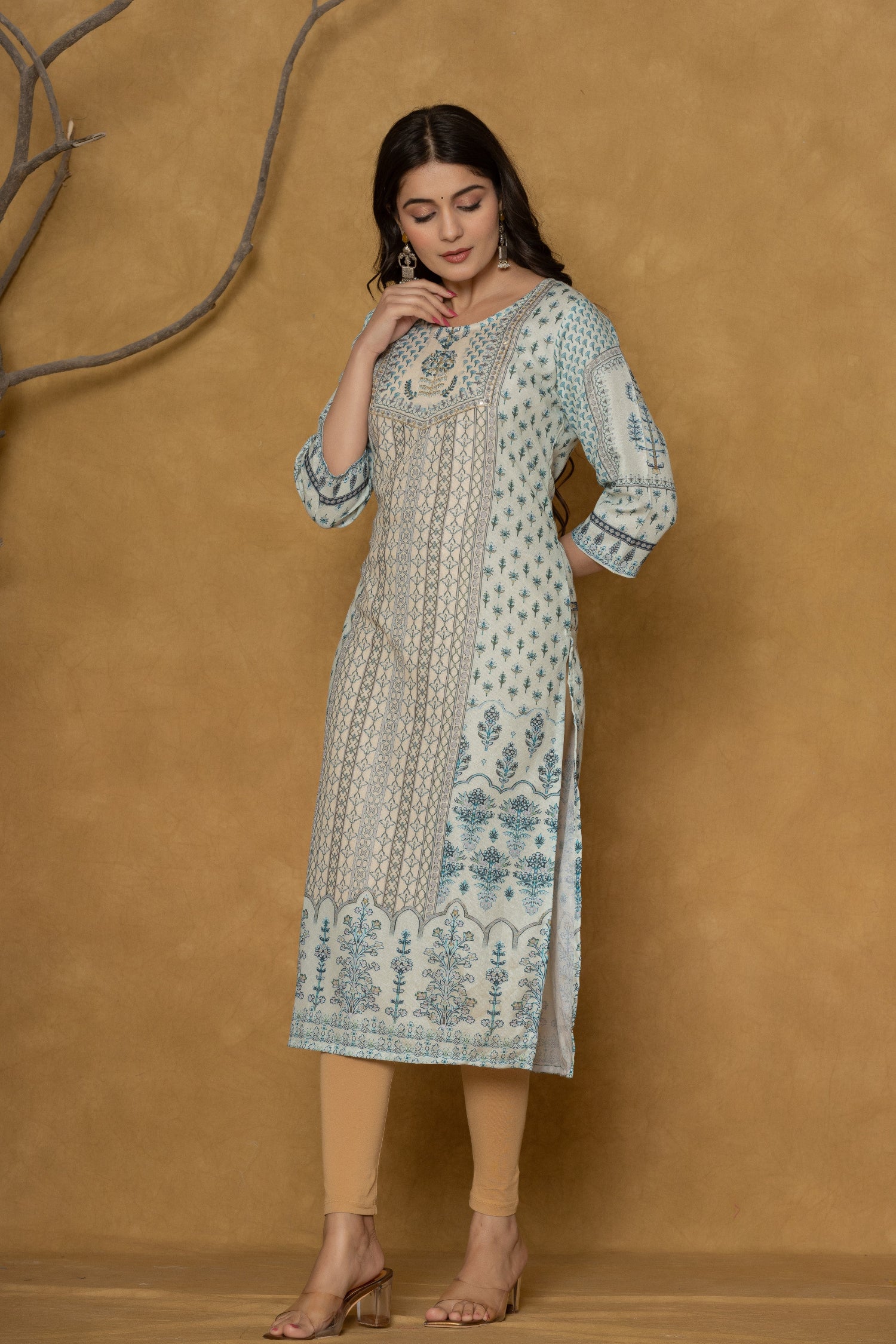Model wearing an elegant pastel blue kurta from The Navra, intricately detailed with white handwork on the round neck and featuring subtle patterns, paired with light beige leggings. Ideal for comfortable daily or casual ethnic wear.