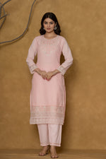 Model in a confident stance, highlighting the full length and overall elegant design of the premium 100% cotton Chifley dupatta set in pink.

