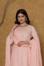 Side profile of model showcasing the graceful movement and soft drape of the pink Chifley dupatta, paired with the cotton suit.