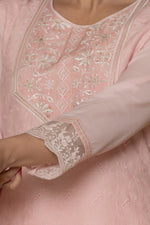 Detailed view of the sleeve and embroidered cuff on the pink cotton kurti, showcasing the subtle design elements.