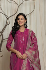Model in a confident stance, highlighting the full length and overall rich design of the pink handblock Rogan work dupatta set, with dupatta draped.