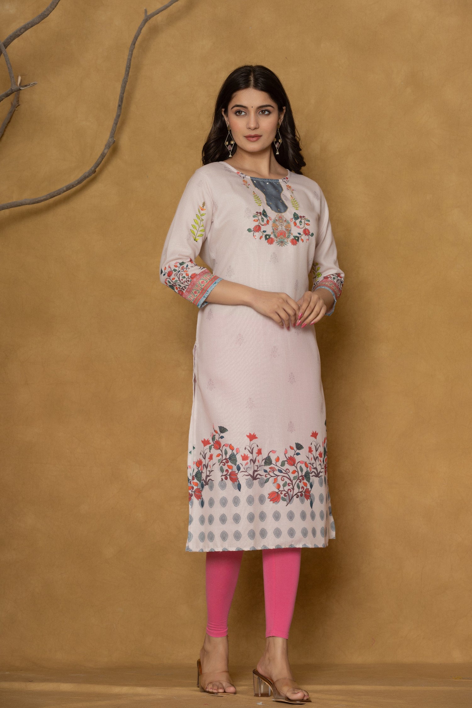 Model in a different pose wearing the pink pannel kurta, highlighting the full length and the subtle floral patterns at the bottom.