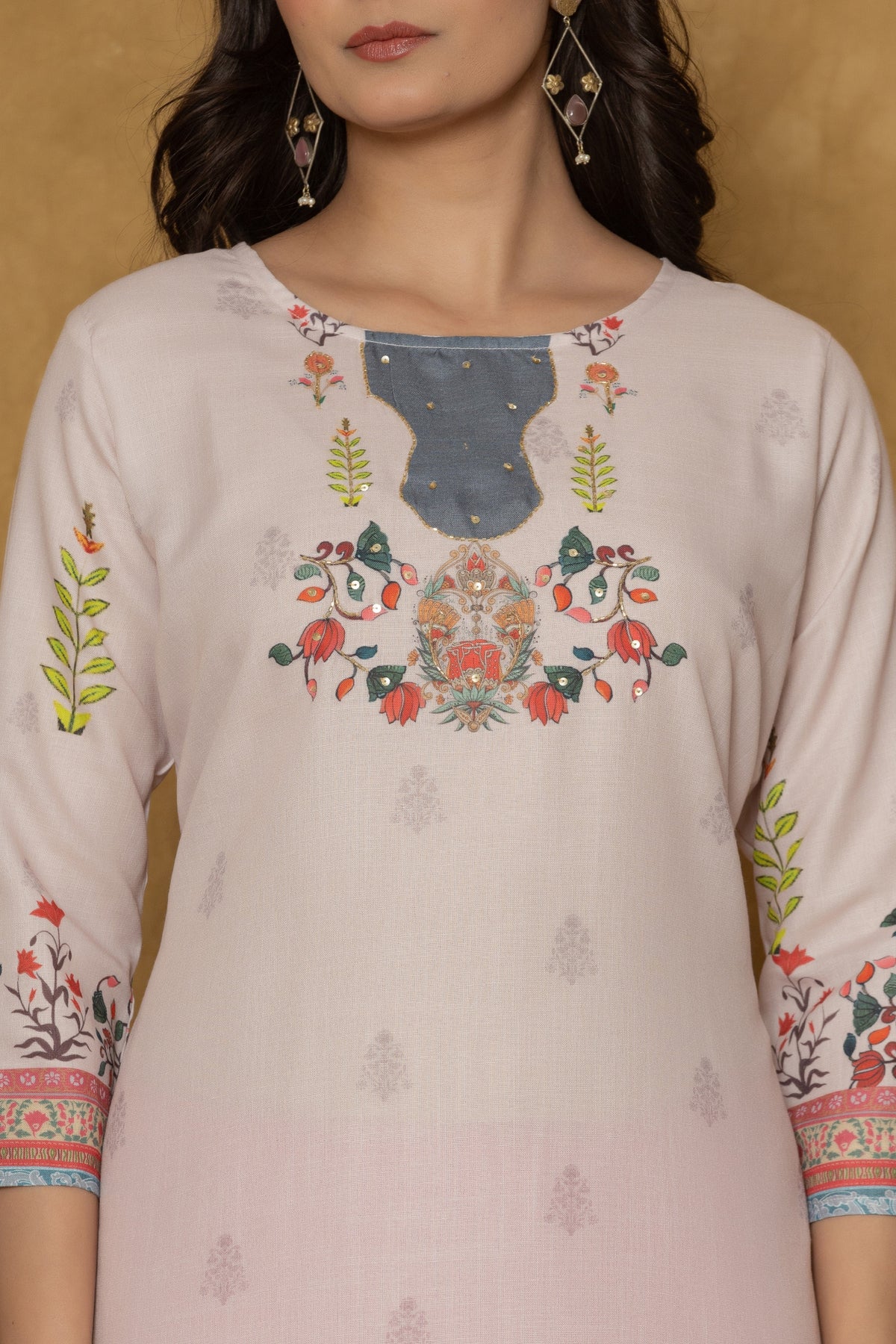 Close-up of the beautiful handwork embroidery and detailing on the neckline of the pink pannel kurta, highlighting craftsmanship.