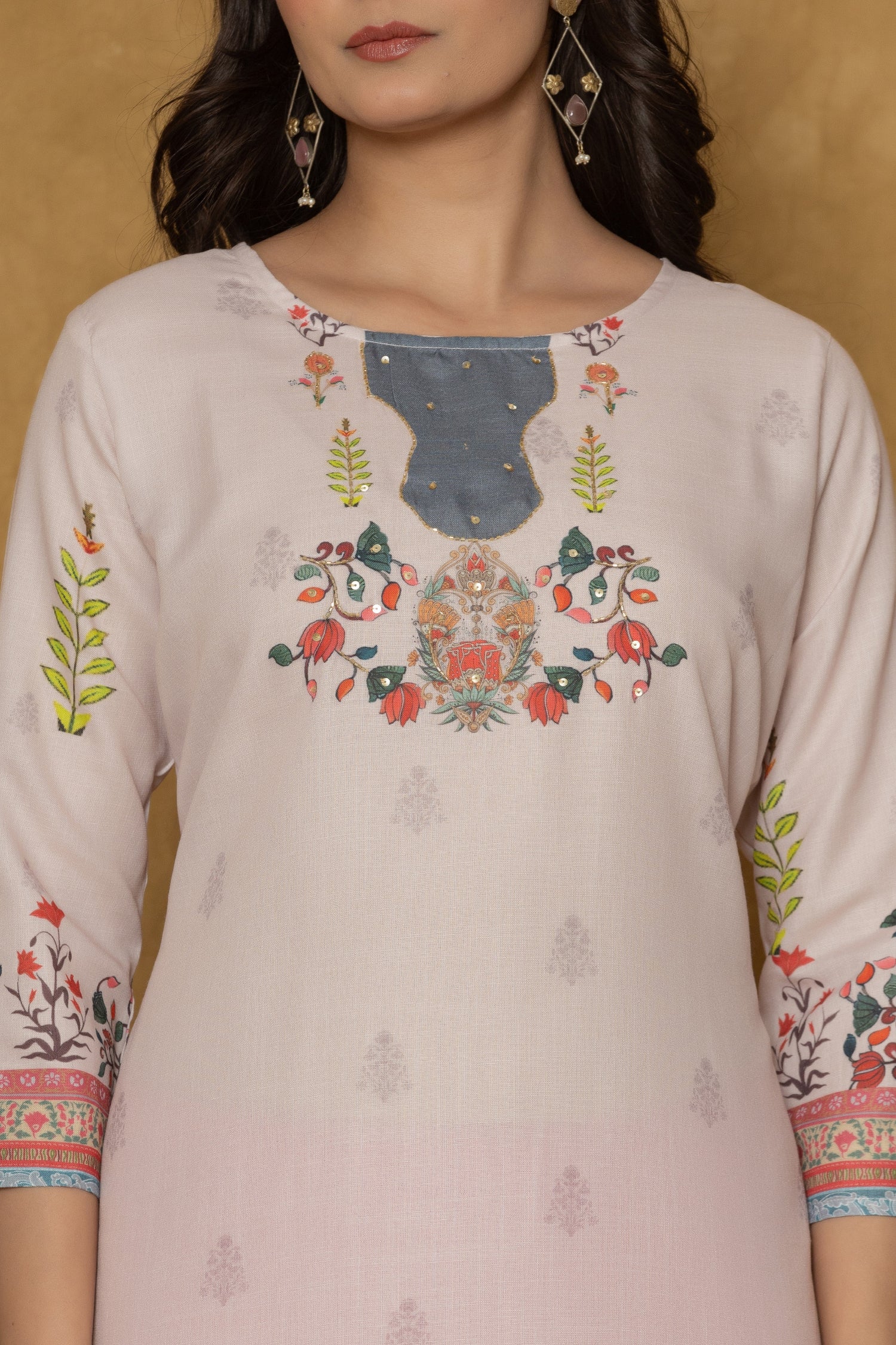 Close-up of the beautiful handwork embroidery and detailing on the neckline of the pink pannel kurta, highlighting craftsmanship.