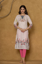 Close-up of the delicate floral and geometric pattern along the hemline of the pink pannel kurta, showcasing the fabric and design detail.