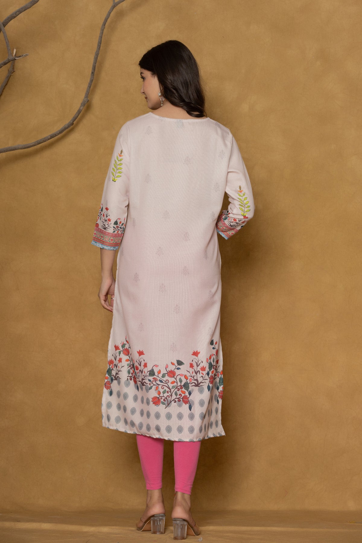 Back view of the beautiful pink pannel kurta, showing the clean design and the continuation of the hemline pattern.