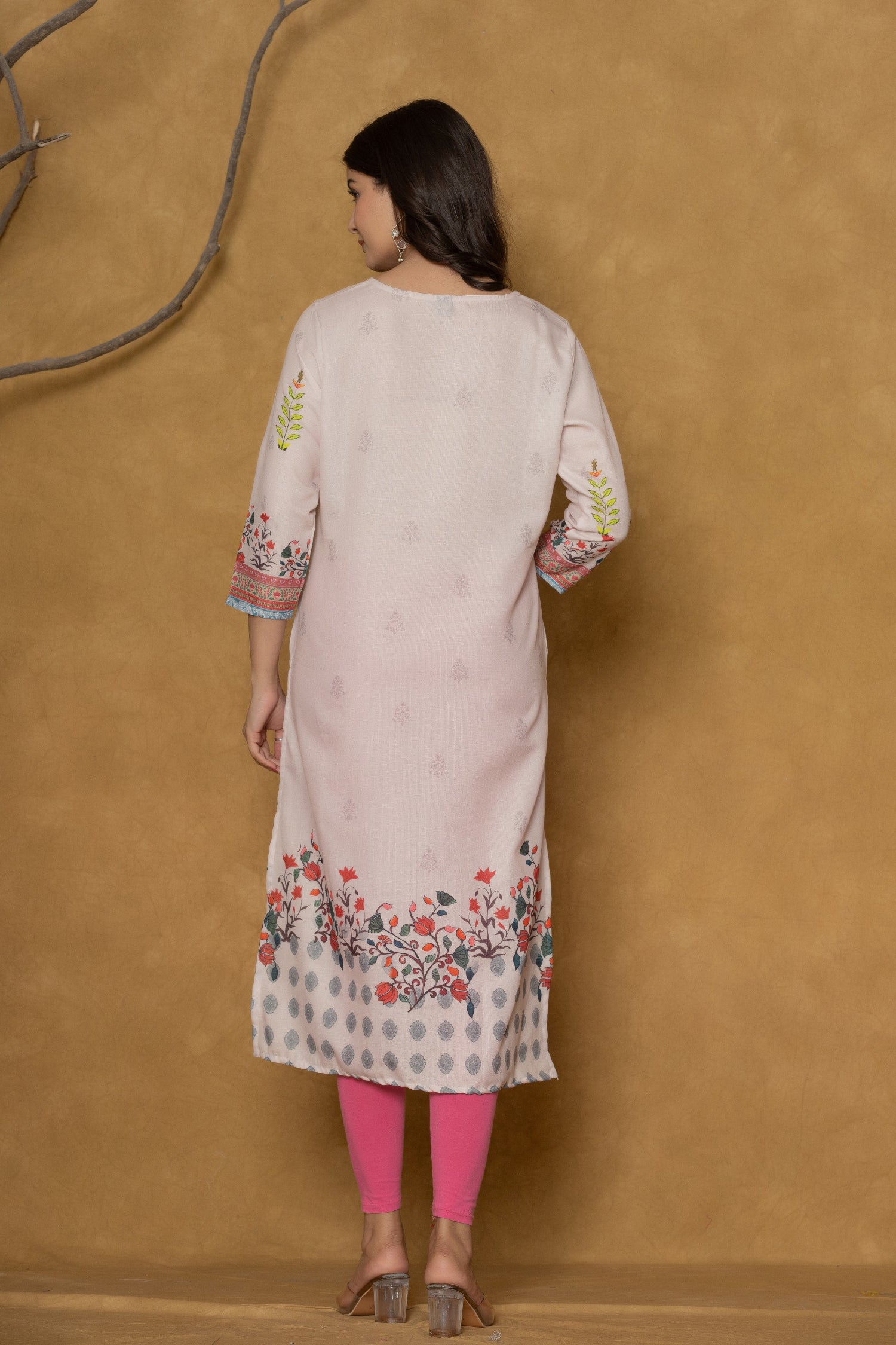 Back view of the beautiful pink pannel kurta, showing the clean design and the continuation of the hemline pattern.