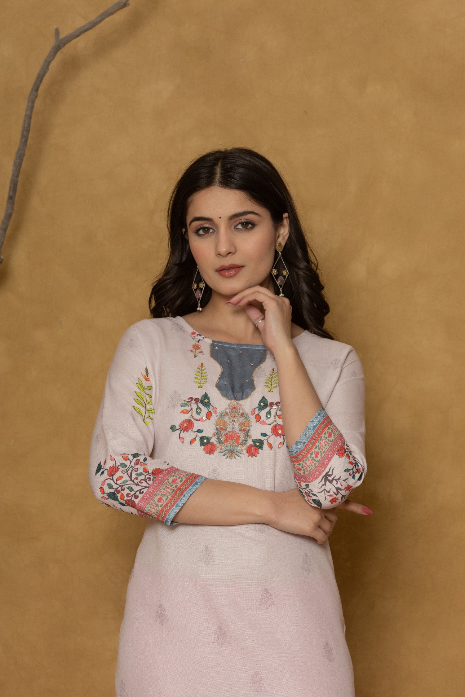 Side profile of model showcasing the comfortable fit and subtle elegance of the pink pannel kurta.