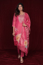Model gracefully wearing the deluxe shimmer organza pink suit in a festive setting, perfect for parties and celebrations.