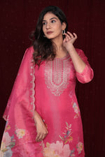  Close-up of intricate silver and pearl embroidery on the neckline and front of the deluxe shimmer organza pink kurti.