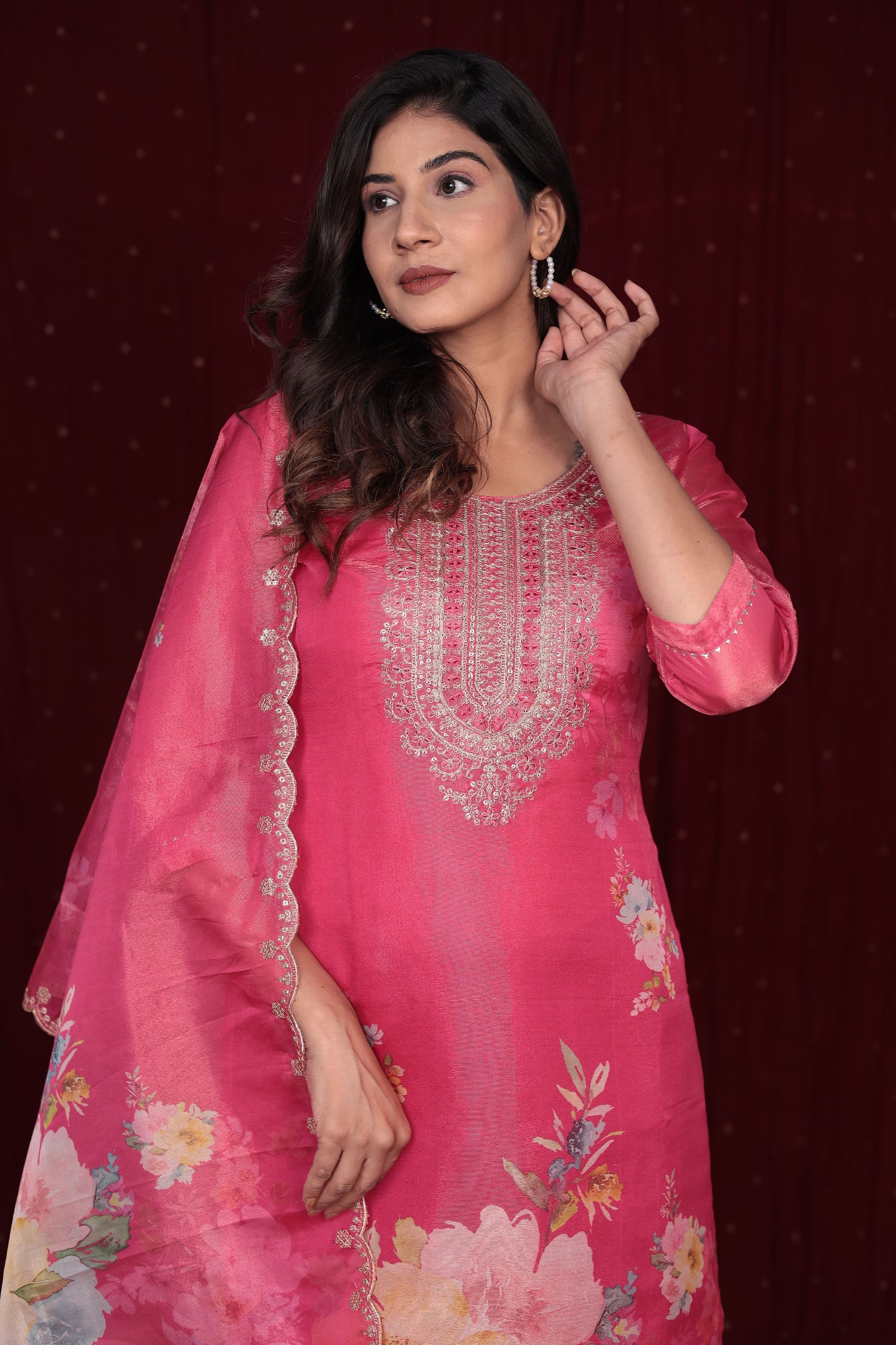 Close-up of intricate silver and pearl embroidery on the neckline and front of the deluxe shimmer organza pink kurti.
