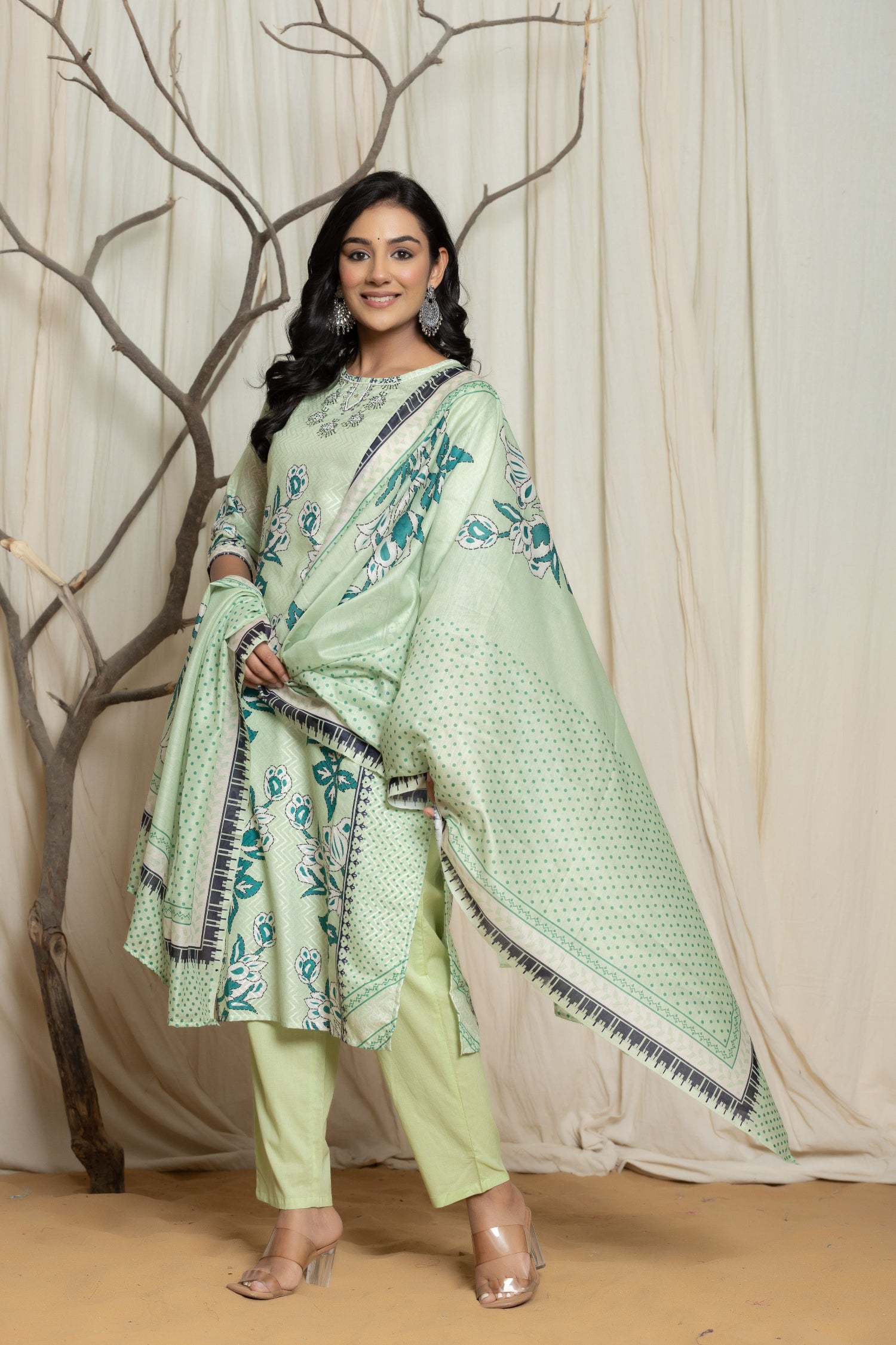 Close-up of the delicate handwork detailing on the round neckline of the pistachio green Lapet digital print kurta, highlighting intricate patterns.