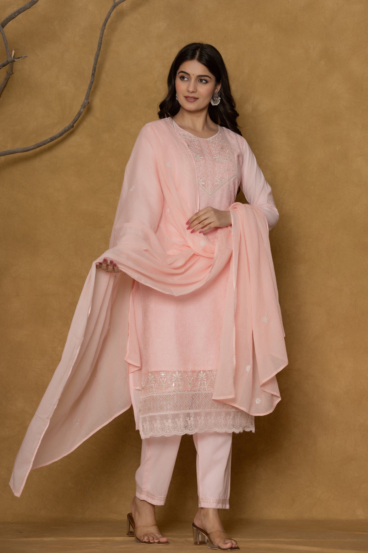 Model wearing a premium 100% cotton Chifley dupatta set from The Navra in a soft pink, featuring delicate embroidery on the kurti, a matching textured dupatta, and comfortable pants. Ideal for comfortable daily or casual wear.