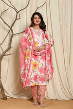 Model wearing a premium cotton floral printed dupatta kurta set from The Navra, featuring vibrant pink, yellow, and orange floral prints on the white-pink kurta, with a matching patterned dupatta and pants. Ideal for comfortable daily or casual ethnic wear.