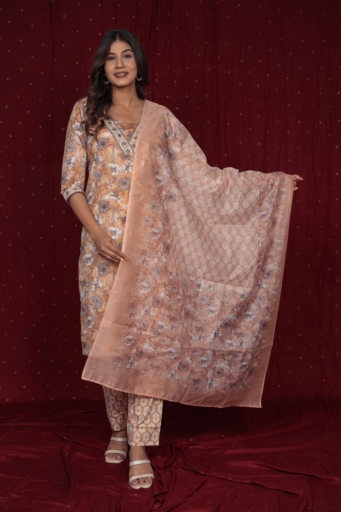 Model wearing a pure cotton mustard brown dupatta set from The Navra, featuring intricate manual embroidery, a printed kurta and matching dupatta, paired with comfortable pants. Ideal for everyday ethnic elegance.