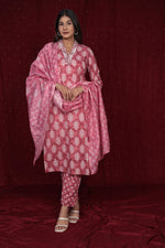Model wearing a pure cotton rust pink dupatta set from The Navra, featuring intricate embroidery on the kurti, a printed dupatta, and matching comfortable pants. Ideal for daily or casual ethnic wear.