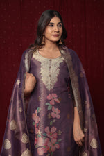 Side profile of model showcasing the comfortable fit and elegant drape of the Deluxe Jacquard Organza purple suit set with its woven jacquard dupatta.