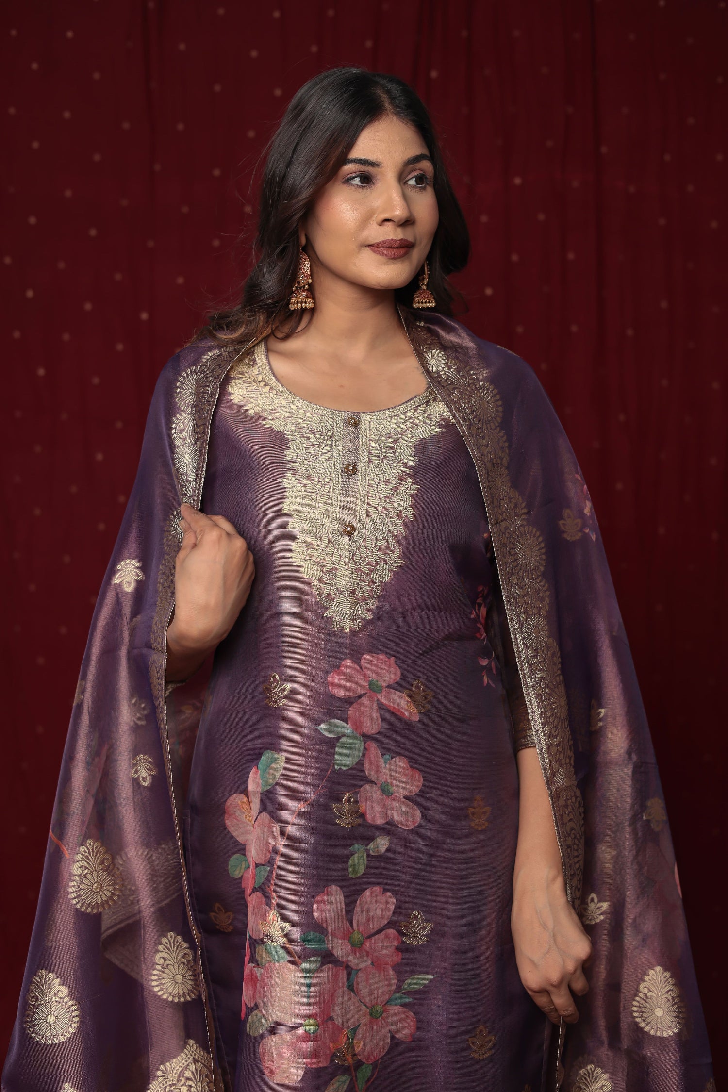 Side profile of model showcasing the comfortable fit and elegant drape of the Deluxe Jacquard Organza purple suit set with its woven jacquard dupatta.