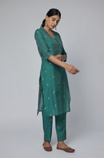 Model in a confident stance, highlighting the full length and overall elegant design of the Rama Green Chanderi Silk co-ord set.